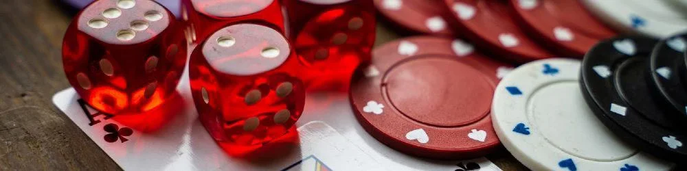Professional dealer in elegant casino setting surrounded by roulette wheels and soft lighting — top-tier live dealer experience at CROWNBD for Bangladeshi players